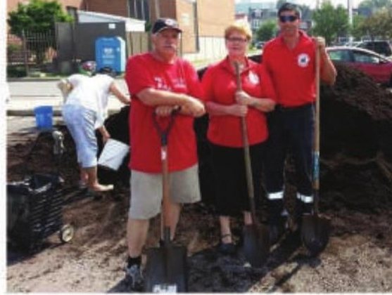 Local 416 Solid Waste members clearing storm-damaged debris during a July garbage rollout